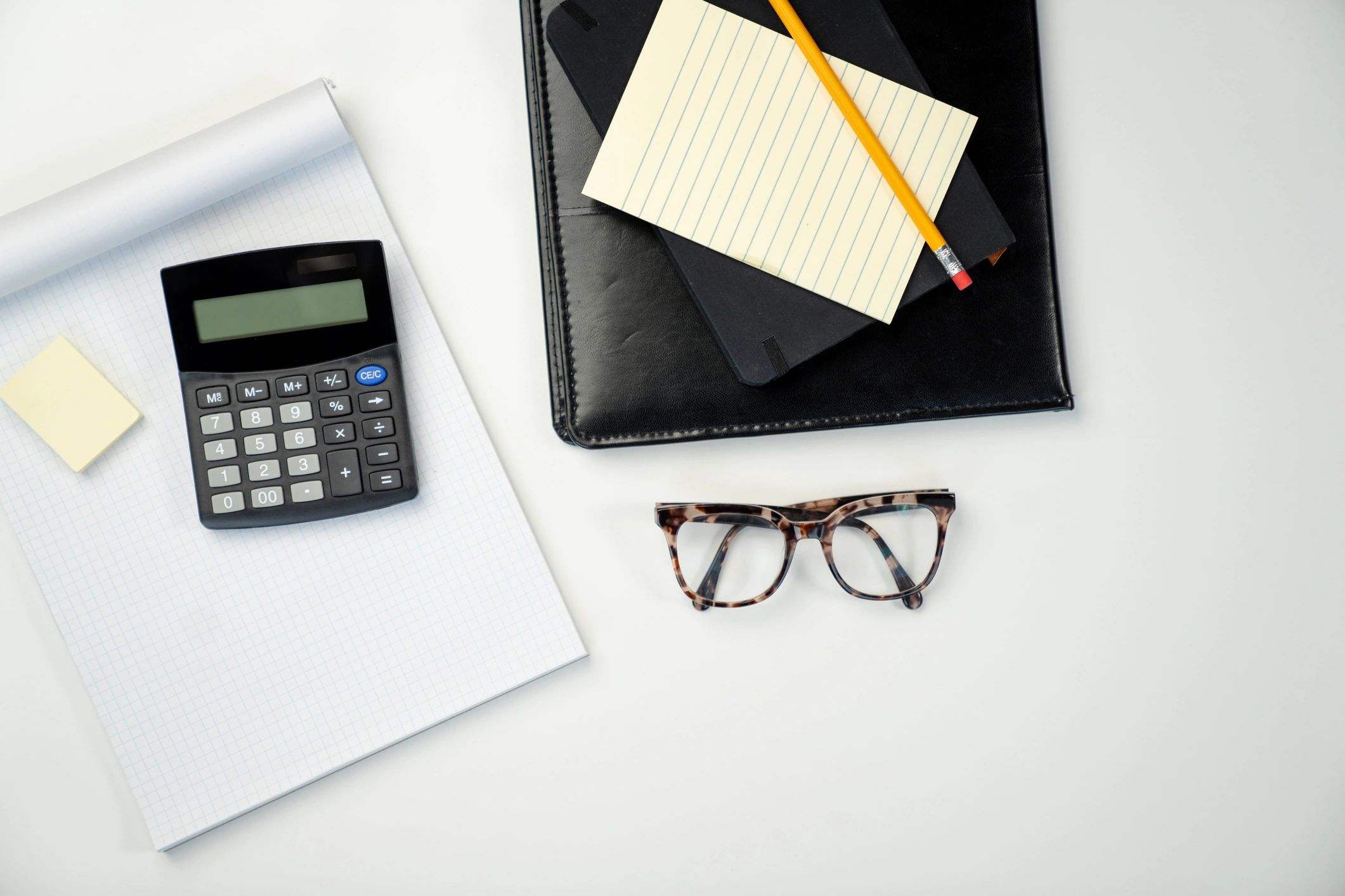 Personal finance tools and calculator on a desk